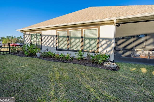 view of property exterior featuring a yard