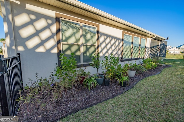 view of property exterior featuring a yard