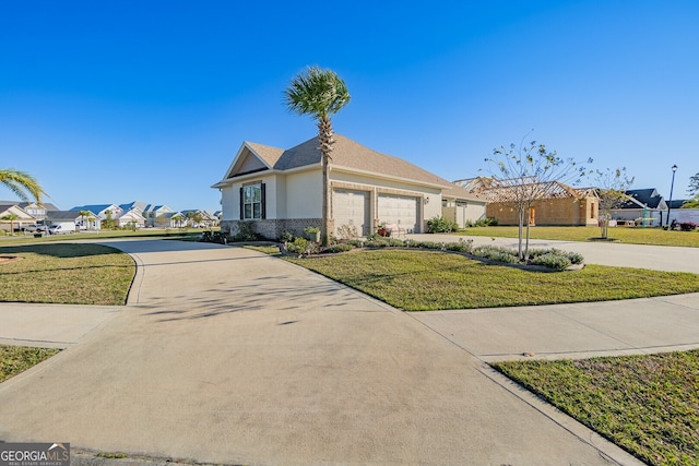 view of front of property featuring a garage and a front lawn