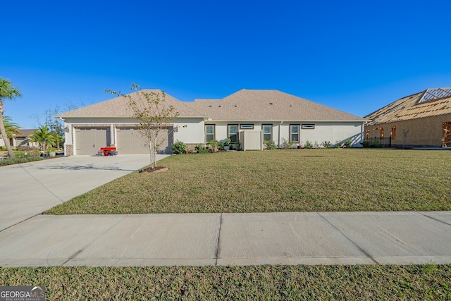 ranch-style house with a garage and a front yard