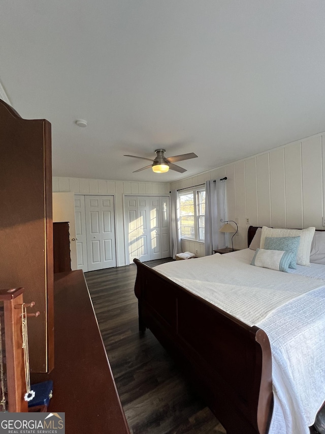 bedroom with ceiling fan and dark wood-type flooring