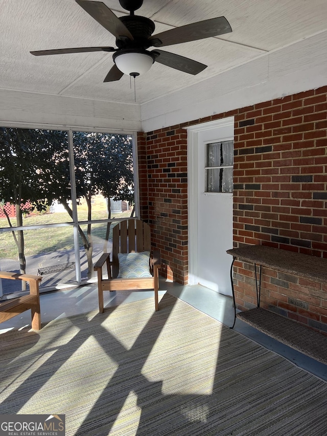 sunroom / solarium with ceiling fan