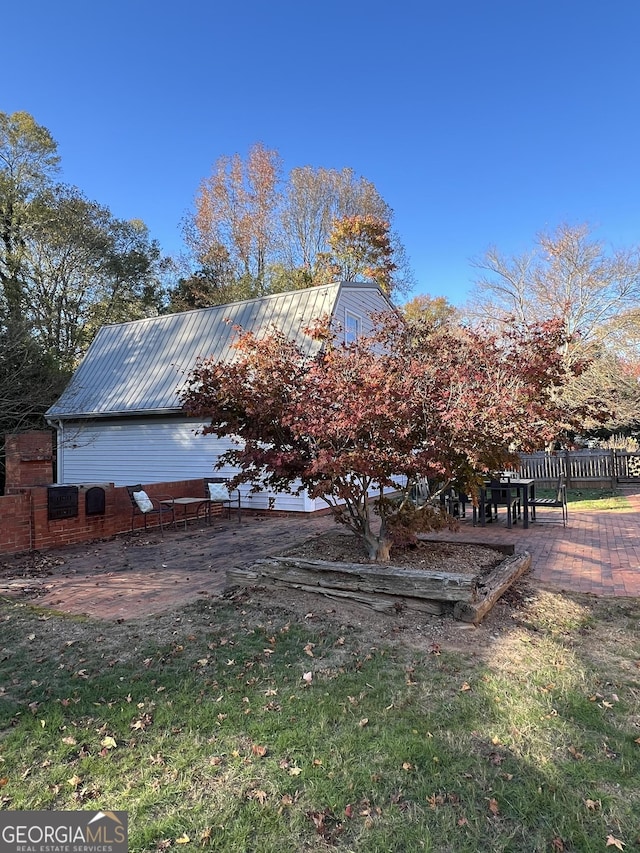 view of property exterior with a patio