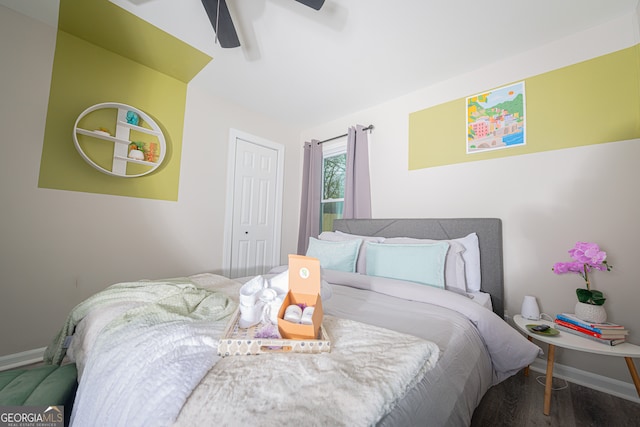 bedroom featuring hardwood / wood-style flooring and ceiling fan