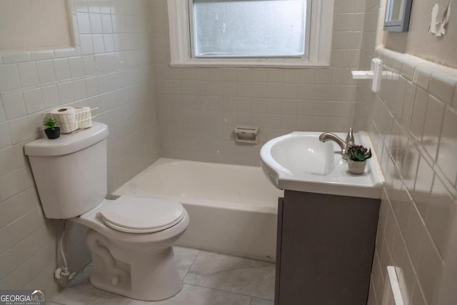 bathroom featuring vanity, toilet, and tile walls