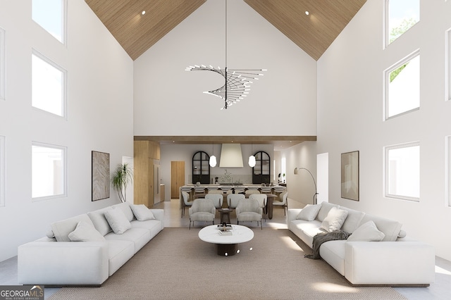 living room featuring wooden ceiling, a high ceiling, and an inviting chandelier