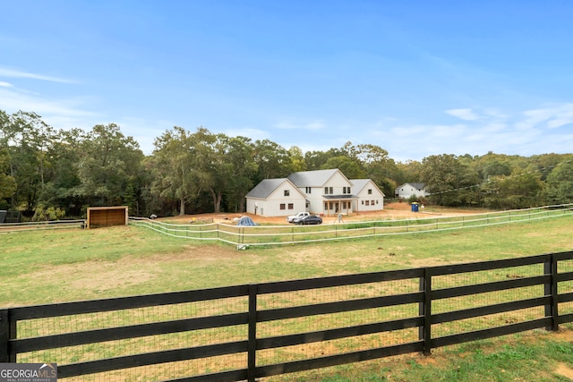 view of yard with a rural view