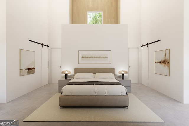 bedroom featuring a towering ceiling