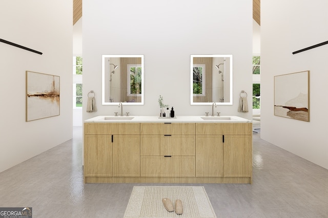 bathroom featuring vanity and a high ceiling