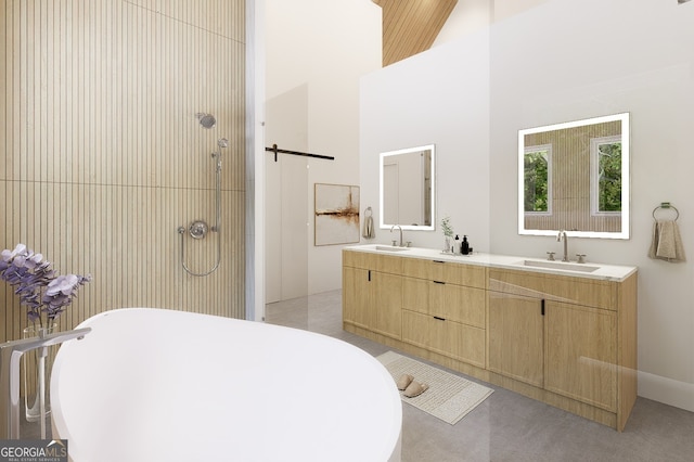 bathroom with vanity, high vaulted ceiling, and independent shower and bath