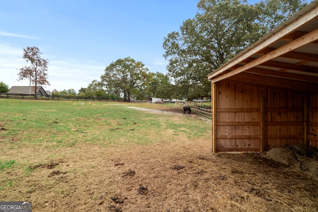 view of yard with a rural view