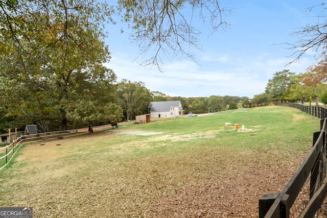 view of yard with a rural view