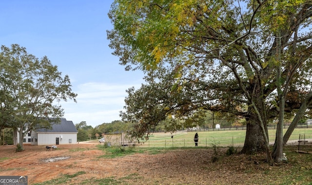 view of yard with a rural view