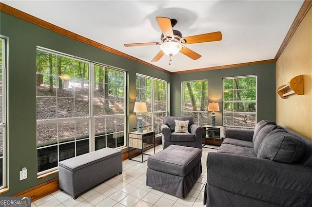 tiled living room with ceiling fan, crown molding, and a wealth of natural light