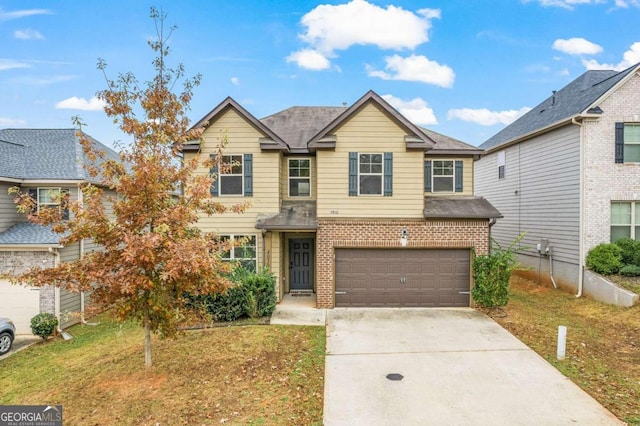 view of front of house with a garage and a front yard