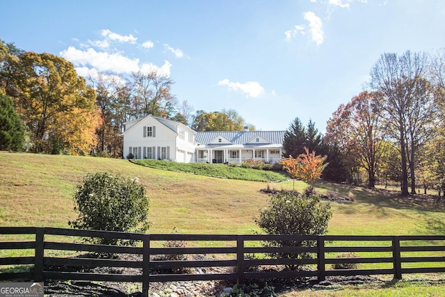 view of yard featuring a garage and fence