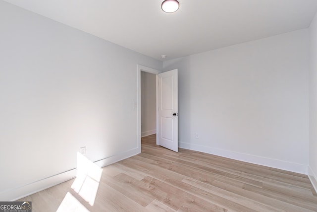 spare room featuring light wood-type flooring