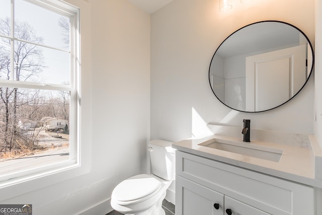 bathroom with vanity and toilet