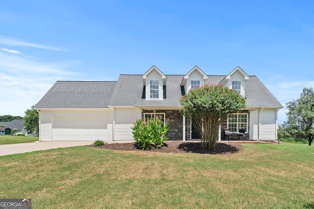 new england style home with a front lawn and a garage