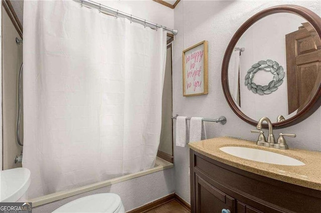 full bathroom featuring shower / tub combo with curtain, vanity, and toilet