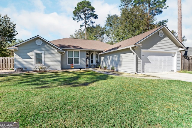 ranch-style home featuring a front yard and a garage