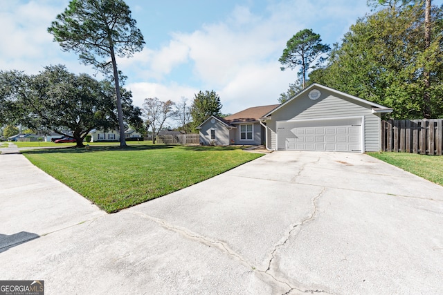 ranch-style home with a front yard and a garage