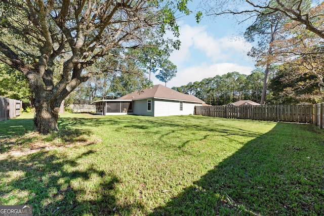 view of yard with a sunroom