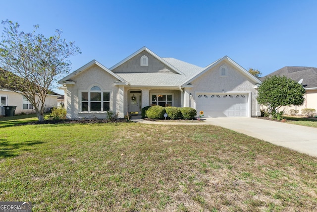 view of front facade featuring a front yard and a garage