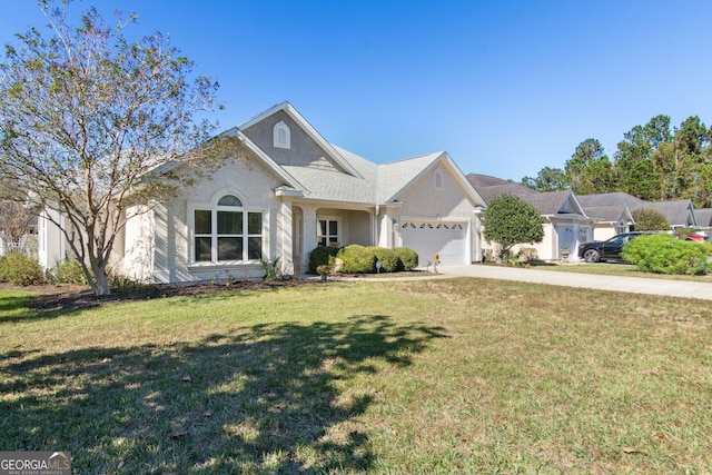 view of front facade featuring a front lawn and a garage