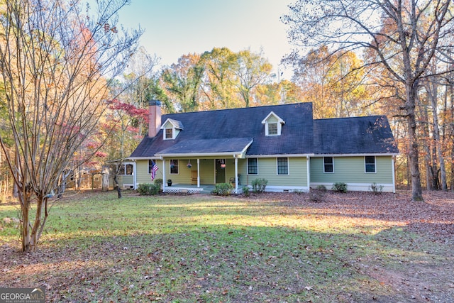 new england style home featuring a front yard and a porch