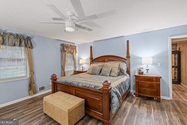 bedroom featuring ceiling fan and dark wood-type flooring