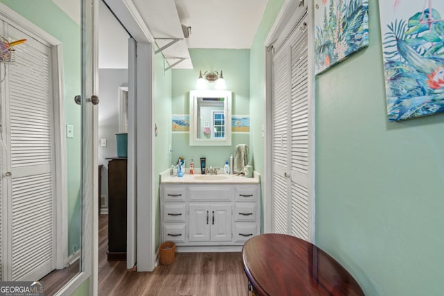 bathroom featuring vanity and wood-type flooring