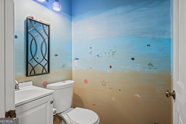 bathroom featuring vanity and toilet