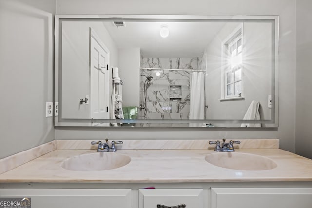 bathroom with vanity and walk in shower