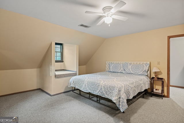 carpeted bedroom featuring ceiling fan and lofted ceiling