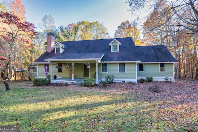 view of front facade featuring covered porch and a front yard