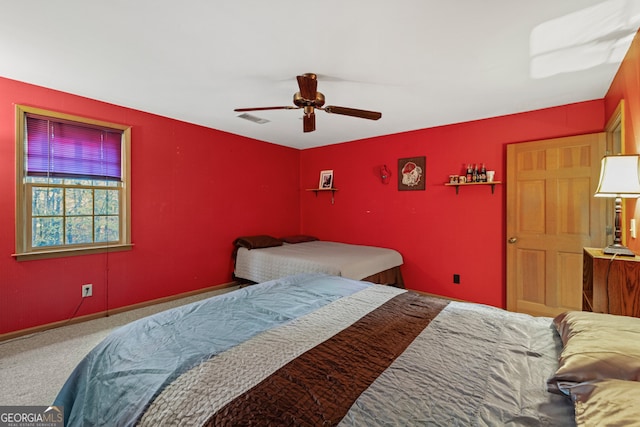 carpeted bedroom featuring ceiling fan