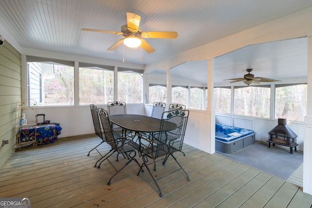 sunroom / solarium with ceiling fan