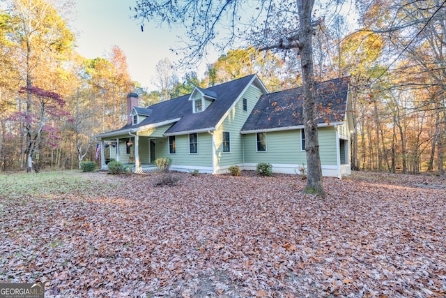 rear view of house with a porch