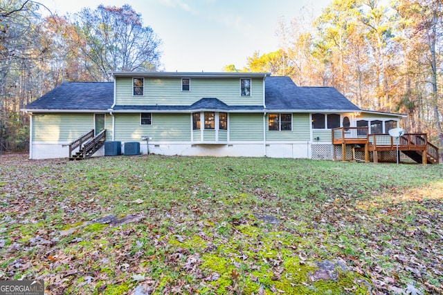 back of house with a yard, a deck, and cooling unit