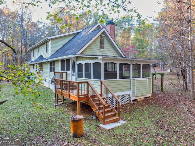 back of property featuring a sunroom