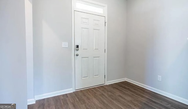 entrance foyer featuring dark wood-style floors and baseboards