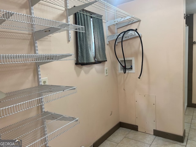 spacious closet featuring tile patterned floors