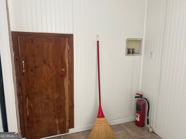 interior space featuring wood walls