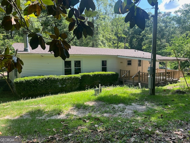 view of property exterior with a deck