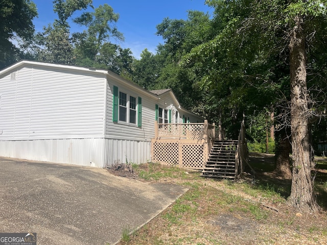 view of side of property with a deck