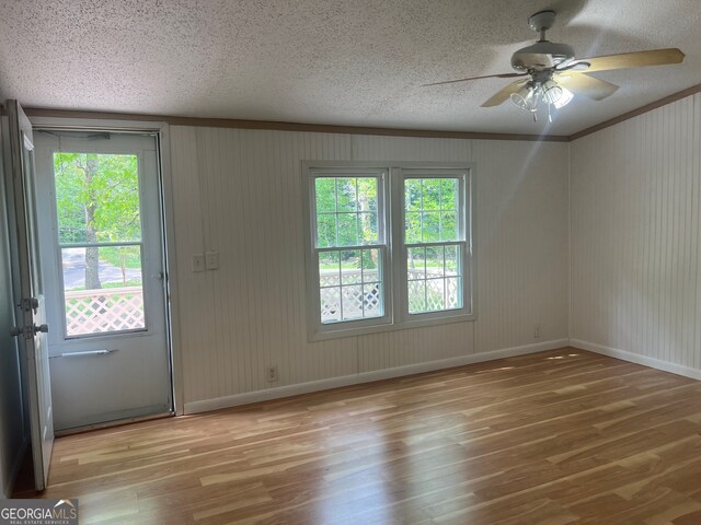 interior space with light wood-type flooring and a healthy amount of sunlight