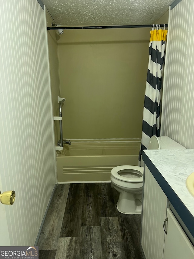 full bathroom with vanity, a textured ceiling, hardwood / wood-style flooring, and toilet