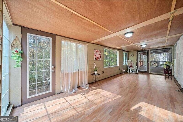 unfurnished sunroom with plenty of natural light