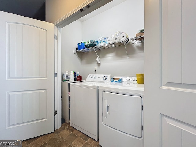 laundry area with washing machine and clothes dryer